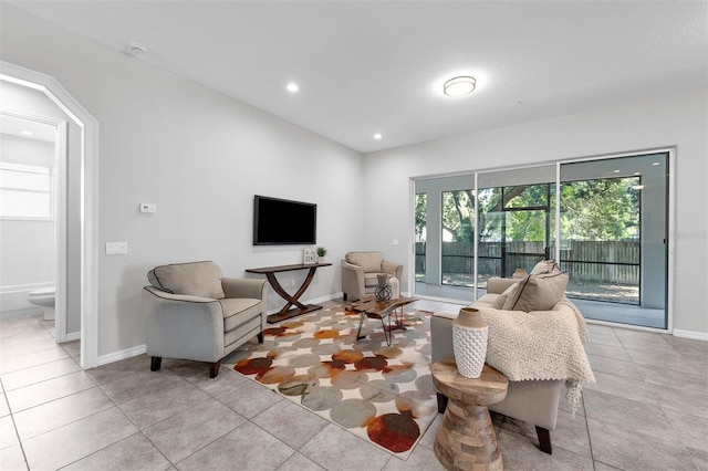 6479 Apple St, Saint Cloud, FL 34771 - living room featuring baseboards, light tile patterned floors, and recessed lighting