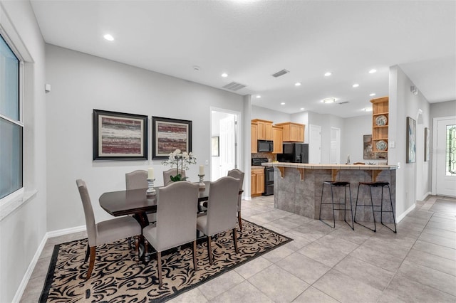 6479 Apple St, Saint Cloud, FL 34771 - dining room with baseboards, recessed lighting, and light tile patterned floors