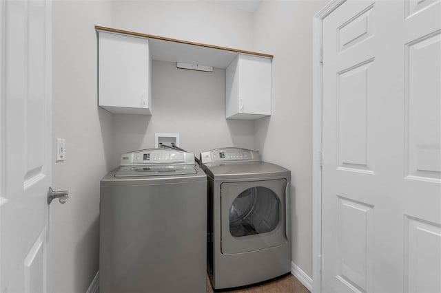 6479 Apple St, Saint Cloud, FL 34771 - washroom with cabinet space, separate washer and dryer, and baseboards