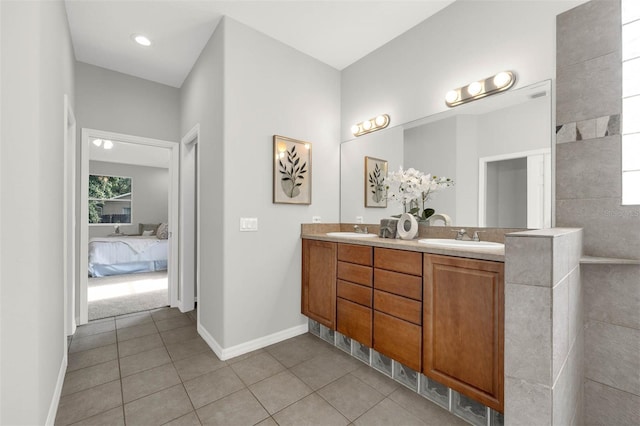 6479 Apple St, Saint Cloud, FL 34771 - bathroom with connected bathroom, double vanity, tile patterned floors, and baseboards