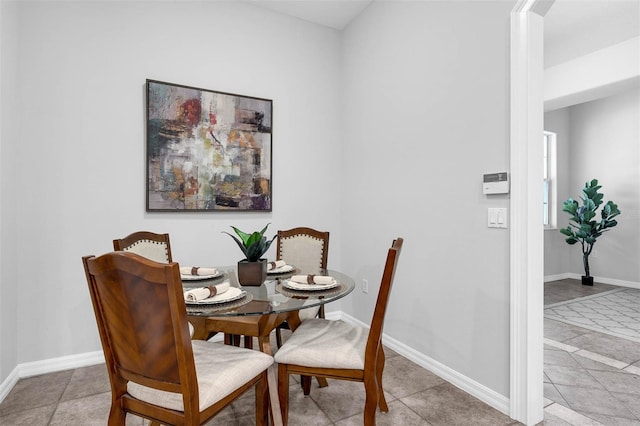 6479 Apple St, Saint Cloud, FL 34771 - dining area featuring light tile patterned floors and baseboards