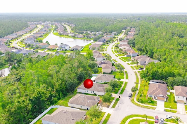 56 Levee Ln, Ormond Beach, FL 32174 - aerial perspective of suburban area with a heavily wooded area and a large body of water