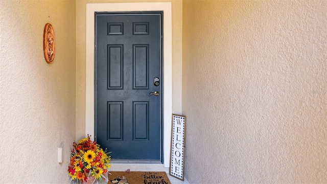 56 Levee Ln, Ormond Beach, FL 32174 - property entrance featuring stucco siding