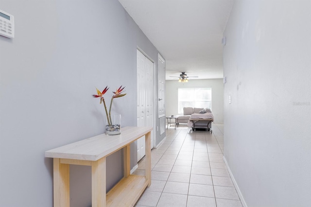 56 Levee Ln, Ormond Beach, FL 32174 - corridor with light tile patterned floors and baseboards