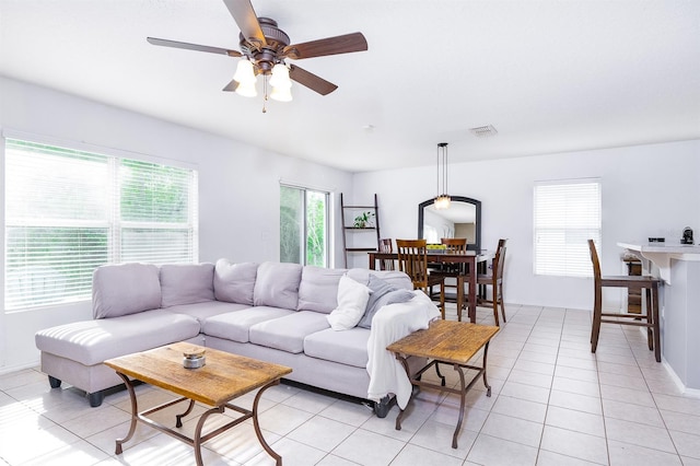 56 Levee Ln, Ormond Beach, FL 32174 - living room with a ceiling fan and light tile patterned flooring