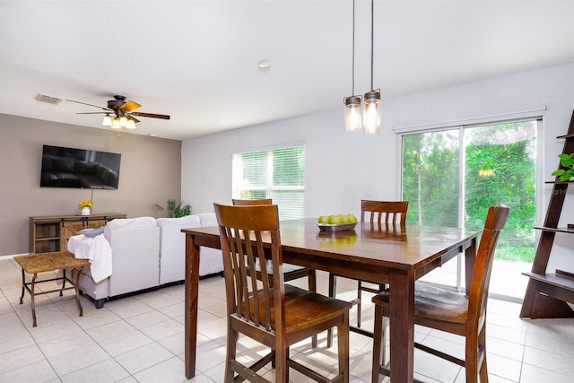 56 Levee Ln, Ormond Beach, FL 32174 - dining area with light tile patterned flooring and ceiling fan