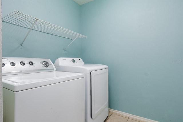 56 Levee Ln, Ormond Beach, FL 32174 - washroom featuring separate washer and dryer and light tile patterned floors