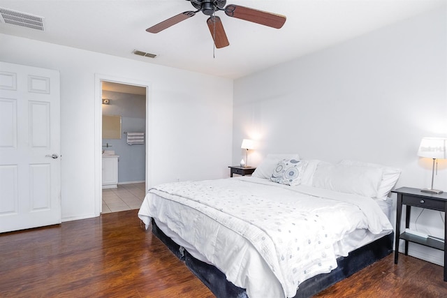 56 Levee Ln, Ormond Beach, FL 32174 - bedroom featuring wood finished floors, ceiling fan, and ensuite bathroom