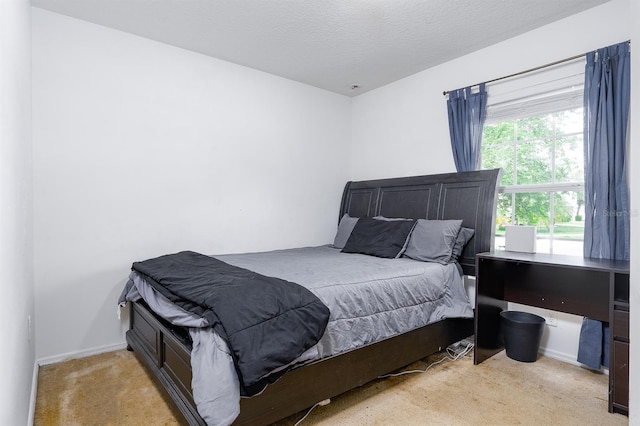 56 Levee Ln, Ormond Beach, FL 32174 - carpeted bedroom with baseboards and a textured ceiling