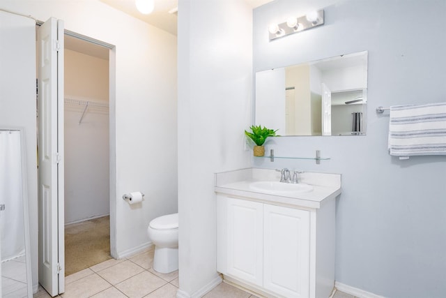56 Levee Ln, Ormond Beach, FL 32174 - bathroom with vanity, tile patterned flooring, and a spacious closet