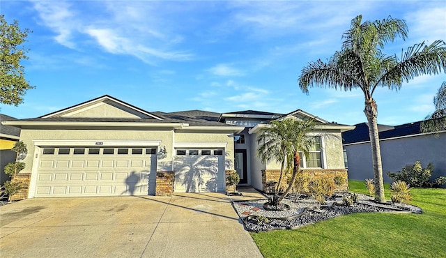 2164 Crosston Cir, Orlando, FL 32824 - view of front facade with stucco siding, concrete driveway, an attached garage, and a front lawn