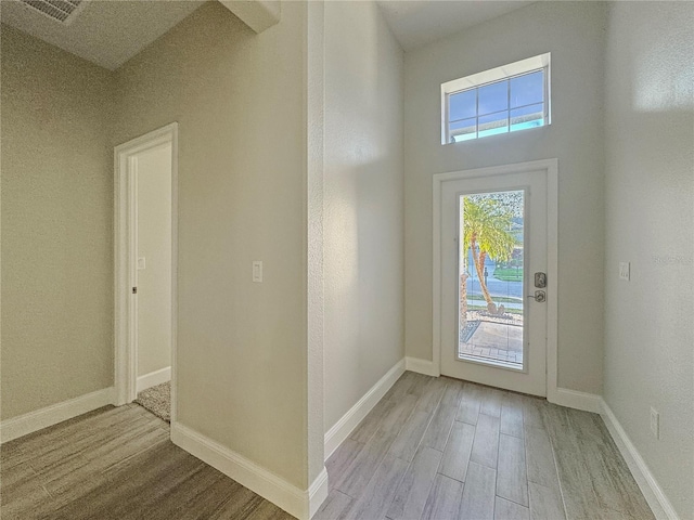 2164 Crosston Cir, Orlando, FL 32824 - foyer entrance featuring light wood finished floors and baseboards