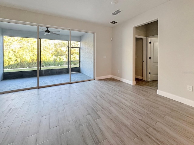 2164 Crosston Cir, Orlando, FL 32824 - empty room with a ceiling fan, wood finished floors, and baseboards