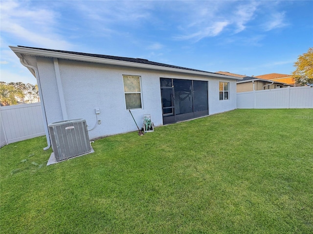 2164 Crosston Cir, Orlando, FL 32824 - rear view of property with central air condition unit and stucco siding