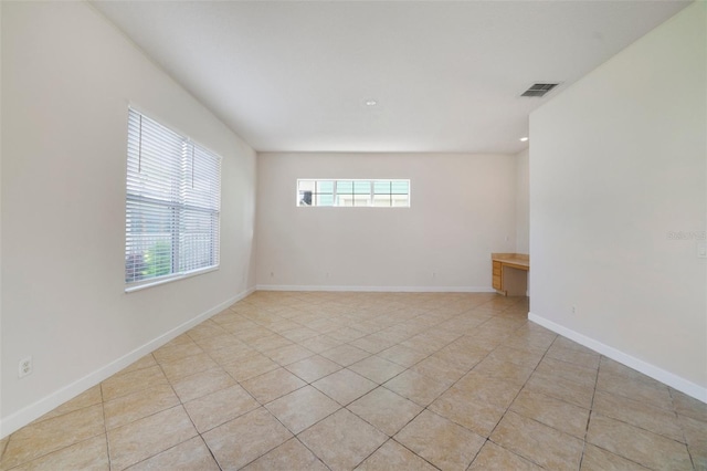 7740 Linkside Loop, Reunion, FL 34747 - empty room featuring healthy amount of natural light, light tile patterned floors, baseboards, and recessed lighting