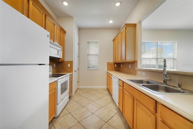 7740 Linkside Loop, Reunion, FL 34747 - kitchen featuring white appliances, a sink, decorative backsplash, recessed lighting, and light countertops