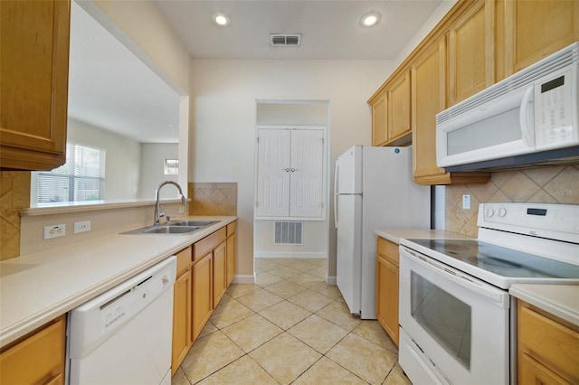 7740 Linkside Loop, Reunion, FL 34747 - kitchen with white appliances, a sink, backsplash, light countertops, and recessed lighting