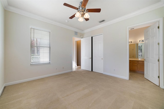 7740 Linkside Loop, Reunion, FL 34747 - unfurnished bedroom with crown molding, light colored carpet, baseboards, ensuite bath, and a closet