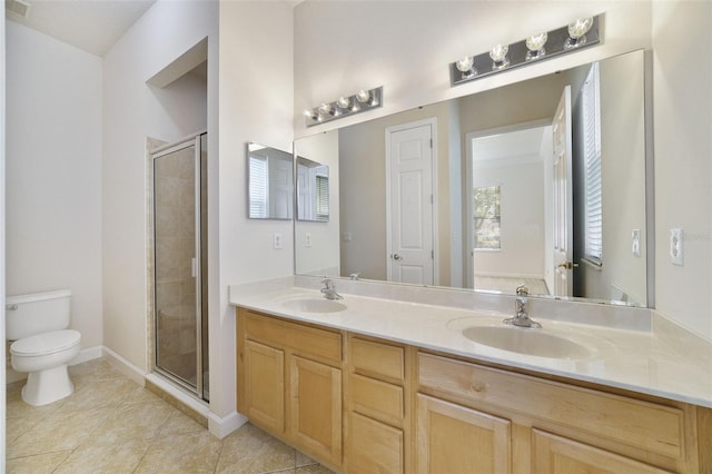 7740 Linkside Loop, Reunion, FL 34747 - bathroom featuring double vanity, a stall shower, toilet, and tile patterned flooring