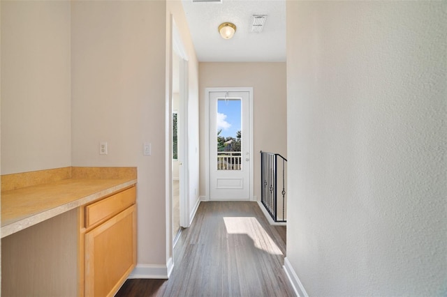 7740 Linkside Loop, Reunion, FL 34747 - hall with dark wood-style floors and baseboards