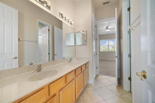 7740 Linkside Loop, Reunion, FL 34747 - full bathroom with ceiling fan, double vanity, tile patterned floors, and baseboards