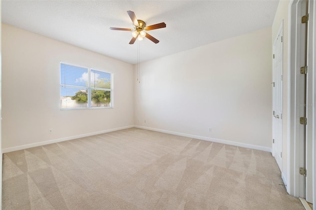 7740 Linkside Loop, Reunion, FL 34747 - spare room with light carpet, a ceiling fan, and baseboards