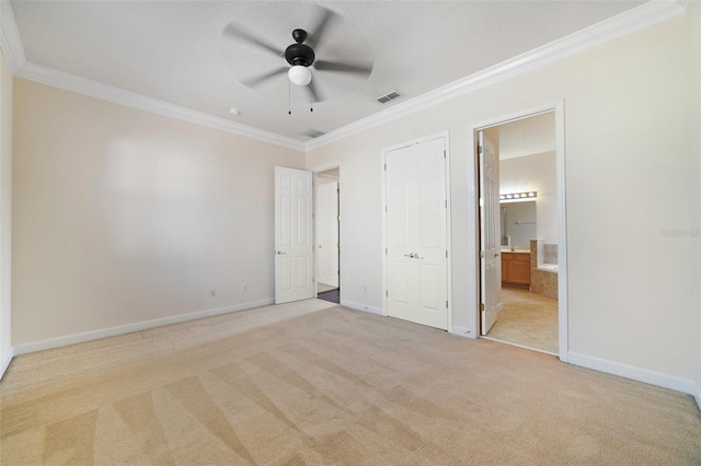 7740 Linkside Loop, Reunion, FL 34747 - unfurnished bedroom with light colored carpet, ornamental molding, baseboards, connected bathroom, and a ceiling fan