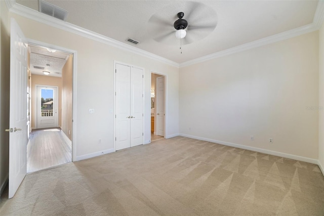 7740 Linkside Loop, Reunion, FL 34747 - unfurnished bedroom with light colored carpet, crown molding, baseboards, and a ceiling fan