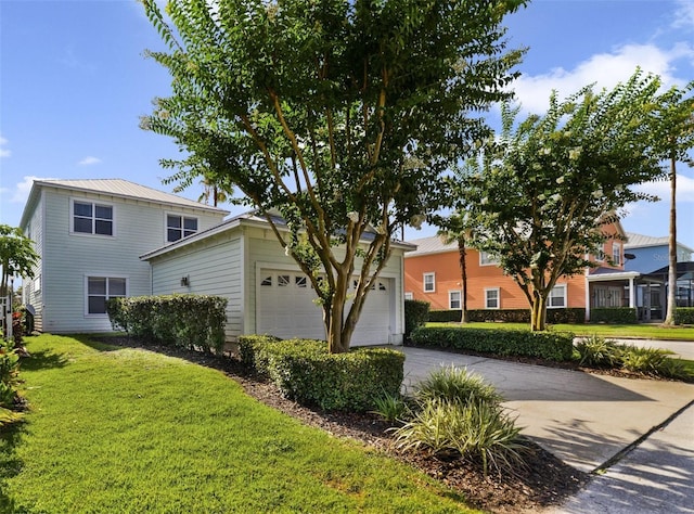7740 Linkside Loop, Reunion, FL 34747 - view of front of property with concrete driveway, a garage, and a front lawn
