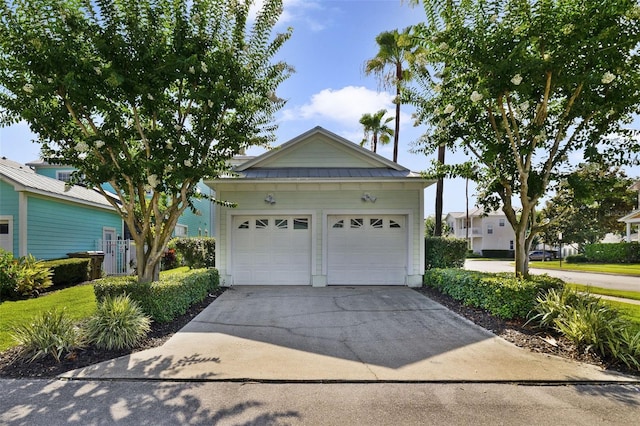 7740 Linkside Loop, Reunion, FL 34747 - view of front of property with driveway and metal roof