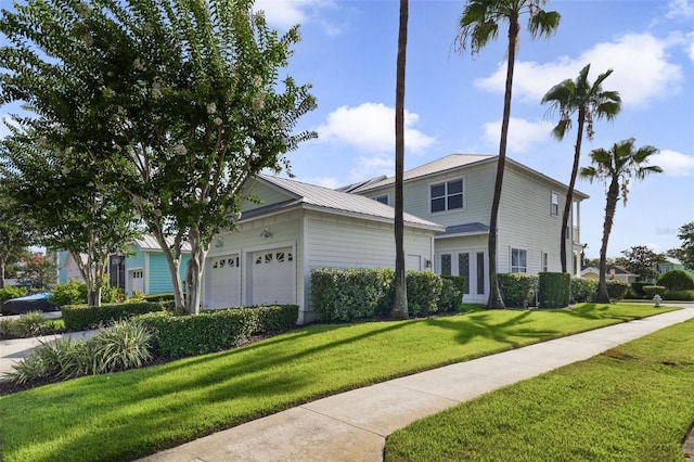 7740 Linkside Loop, Reunion, FL 34747 - view of front of house with a front yard and an attached garage