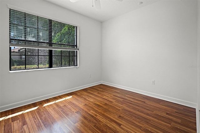 1394 Palmetto Dunes St, Champions Gate, FL 33896 - empty room with a ceiling fan, wood finished floors, and baseboards