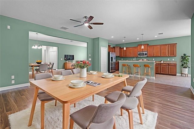 1394 Palmetto Dunes St, Champions Gate, FL 33896 - dining room with baseboards, light wood finished floors, a ceiling fan, and recessed lighting