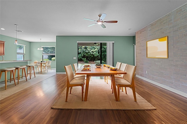 1394 Palmetto Dunes St, Champions Gate, FL 33896 - dining room featuring a ceiling fan, wood finished floors, and baseboards