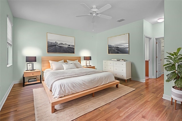 1394 Palmetto Dunes St, Champions Gate, FL 33896 - bedroom with wood finished floors, baseboards, and ceiling fan