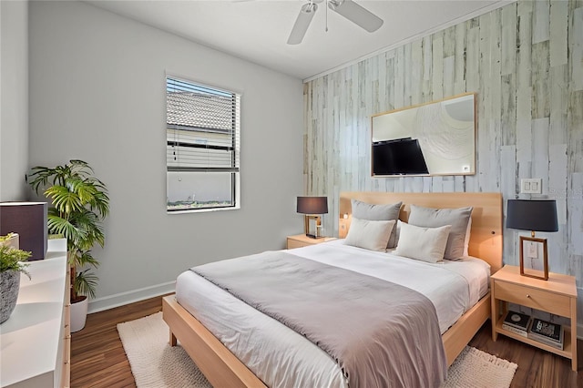 1394 Palmetto Dunes St, Champions Gate, FL 33896 - bedroom featuring an accent wall, baseboards, wood finished floors, and a ceiling fan
