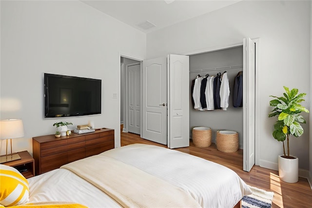 1394 Palmetto Dunes St, Champions Gate, FL 33896 - bedroom with a closet, wood finished floors, and baseboards
