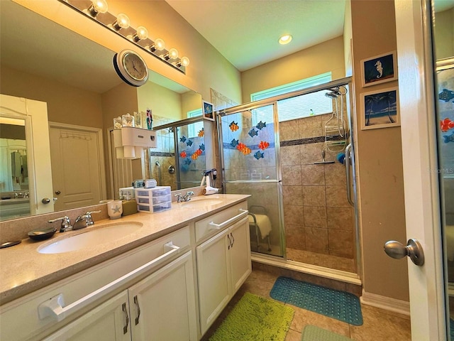 3333 Sagebrush St, Harmony, FL 34773 - bathroom featuring double vanity, a stall shower, and tile patterned flooring
