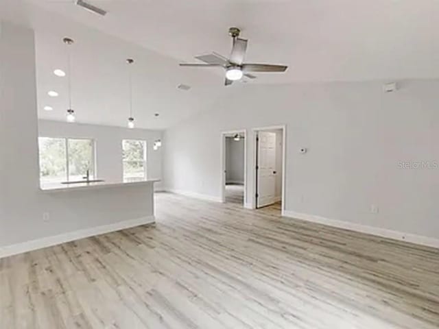14512 SW 25th Ln, Ocala, FL 34481 - empty room featuring lofted ceiling, baseboards, light wood-style flooring, ceiling fan, and recessed lighting