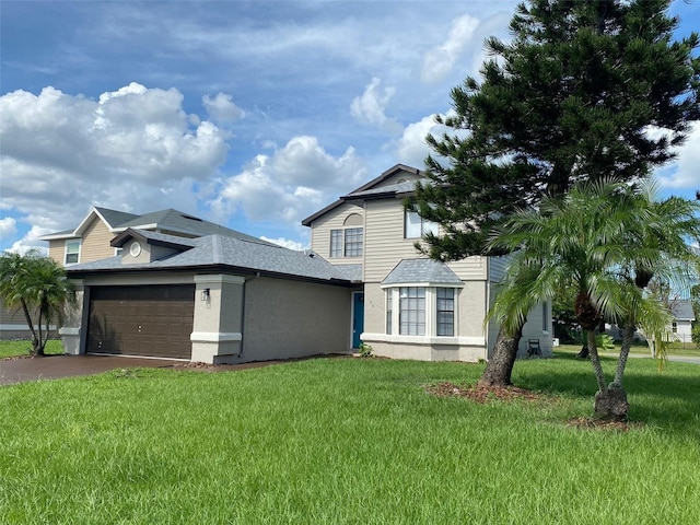 198 N Lake Ct, Kissimmee, FL 34743 - view of home's exterior featuring a yard, an attached garage, and stucco siding