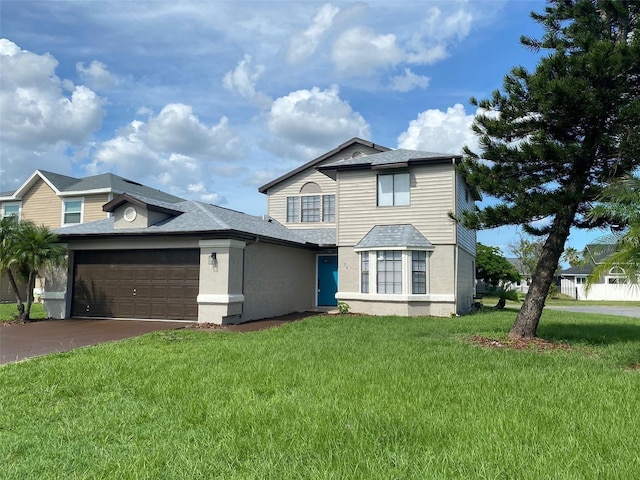 198 N Lake Ct, Kissimmee, FL 34743 - traditional home featuring an attached garage, a front yard, roof with shingles, and driveway