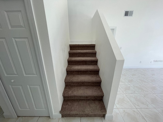 198 N Lake Ct, Kissimmee, FL 34743 - stairway featuring baseboards