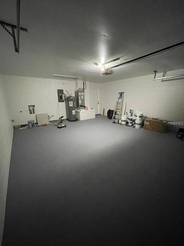 198 N Lake Ct, Kissimmee, FL 34743 - garage with water heater, electric panel, heating unit, and a garage door opener