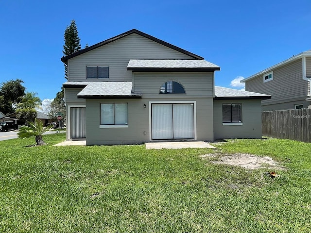 198 N Lake Ct, Kissimmee, FL 34743 - back of property with a shingled roof