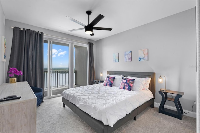 13427 Blue Heron Beach Dr Unit 1703, Orlando, FL 32821 - bedroom with carpet, access to outside, a water view, and ceiling fan