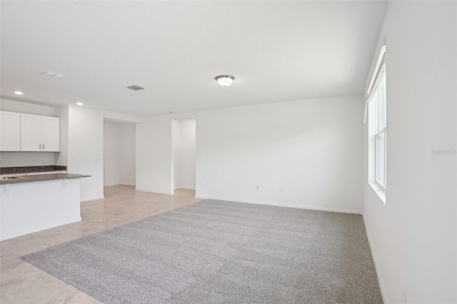 3214 Viceroy Ct, Kissimmee, FL 34759 - unfurnished living room with recessed lighting, light tile patterned floors, a sink, and baseboards