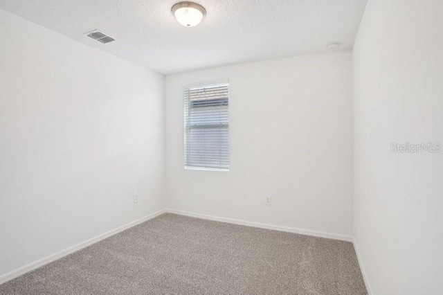 3214 Viceroy Ct, Kissimmee, FL 34759 - spare room with carpet floors, baseboards, and a textured ceiling