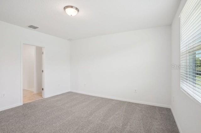 3214 Viceroy Ct, Kissimmee, FL 34759 - carpeted spare room with baseboards