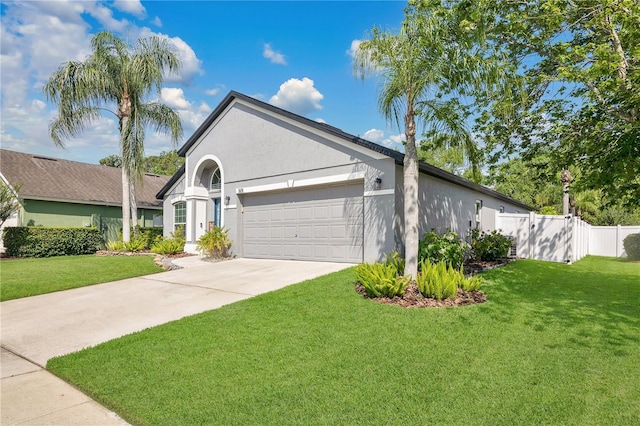 501 Dunoon St, Ocoee, FL 34761 - view of front of house with a garage, stucco siding, and concrete driveway