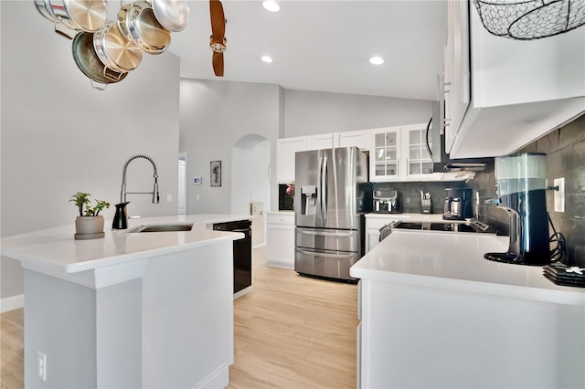501 Dunoon St, Ocoee, FL 34761 - kitchen with stainless steel fridge with ice dispenser, dishwasher, arched walkways, a sink, and tasteful backsplash